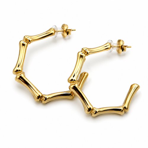 Gold hoop earrings designed to look like segmented bamboo or bone links, shown on a clean white background.