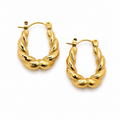 Gold hoop earrings on a white background