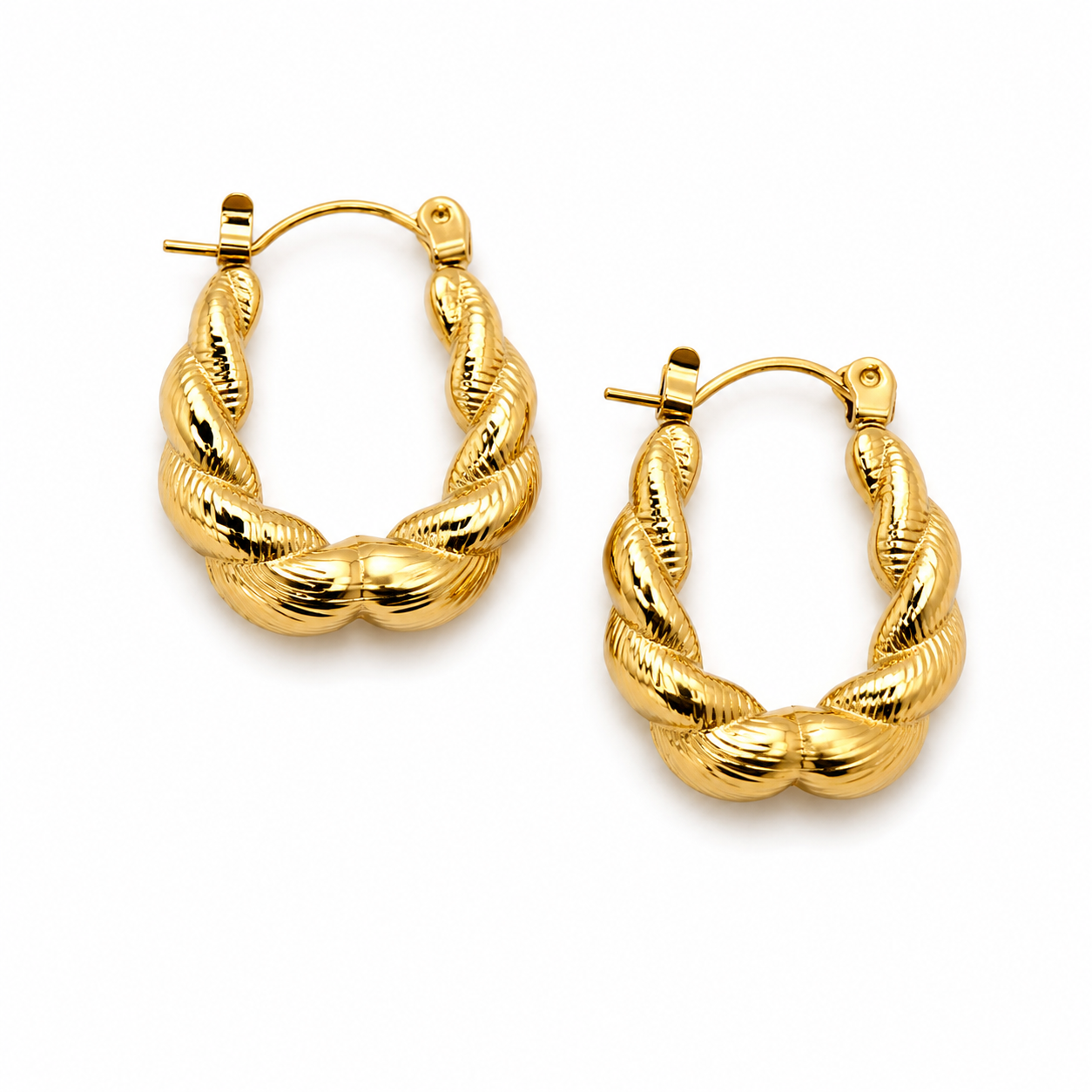 Gold hoop earrings on a white background