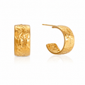 A pair of gold huggie hoop earrings with detailed floral engravings, shown from the front and side on a white background with a soft reflection.
